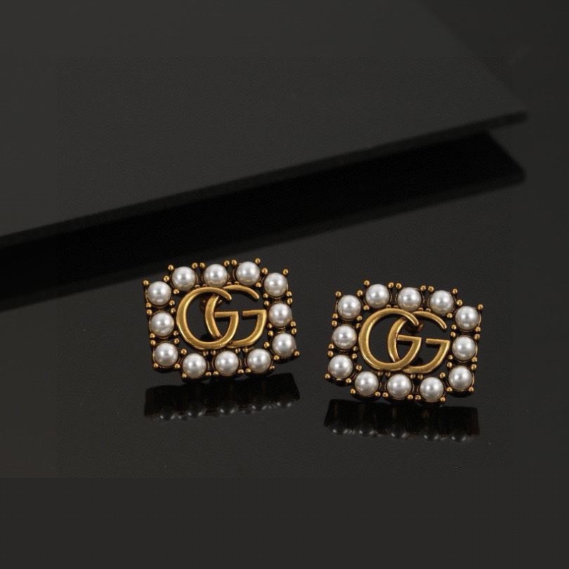 G*u*i earrings